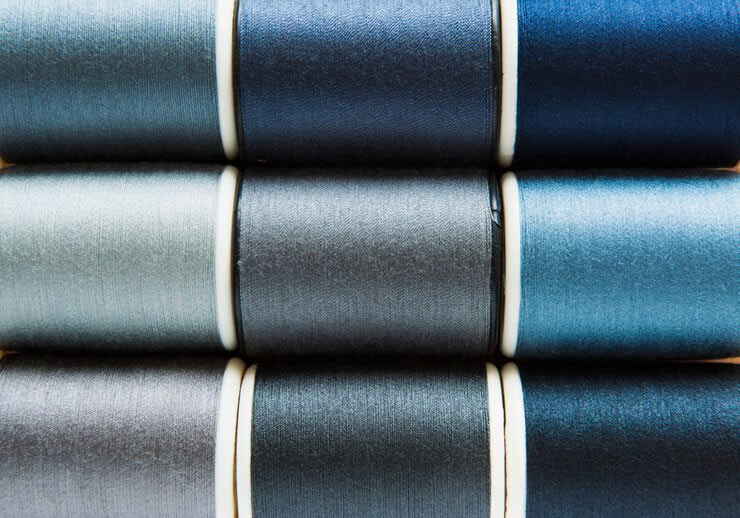 spools of blue and gray thread